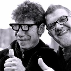 Two guys giving their thumbs up