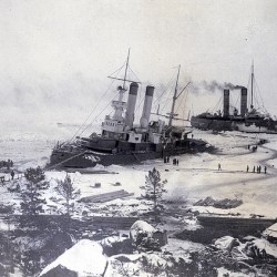 Old photo of two ice breakers near shore