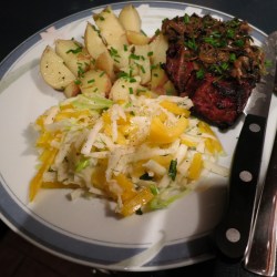 Dinner plate of steak, mushrooms, potatoes, zucchini slaw