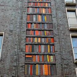 Bookshelf mural made of ceramic tile